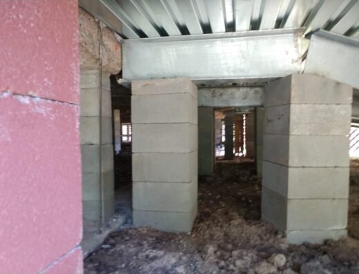 Crawl space with a concrete block pier support beneath a Houston-area home, Du-West Foundation Repair project