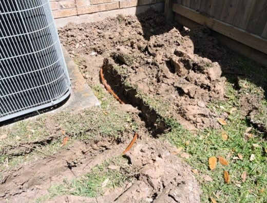 Excavation pit dug beside a home's foundation for Du-West Foundation Repair work in the Houston area