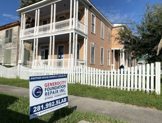 Historic Galveston pier and beam house with a yard sign reading "Another house expertly leveled by Generocity Foundation Repair Inc."