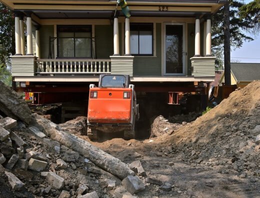 Heights Foundation Repair Experts crew raising a house during a foundation repair job