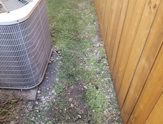 Excavated area beside a Houston home's exterior unit during Jericho Foundation Repair work
