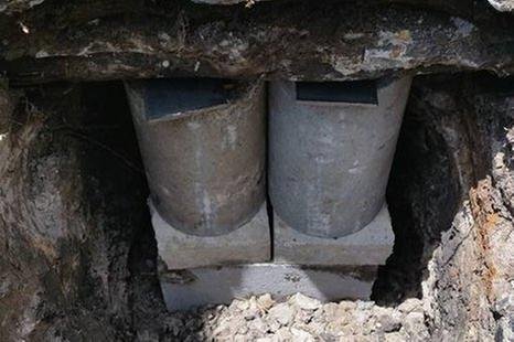 Close-up of newly installed concrete support piers beneath a home, a Ruben's Foundation Repair project in Pasadena TX