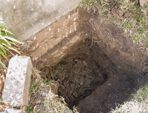 Concrete grade beam carefully exposed during a Structured Foundation Repairs Houston foundation job
