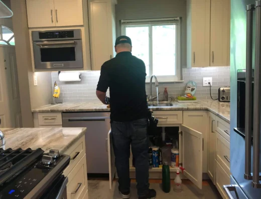 Trademark Inspection Services inspector Curt Markham inspecting a kitchen sink