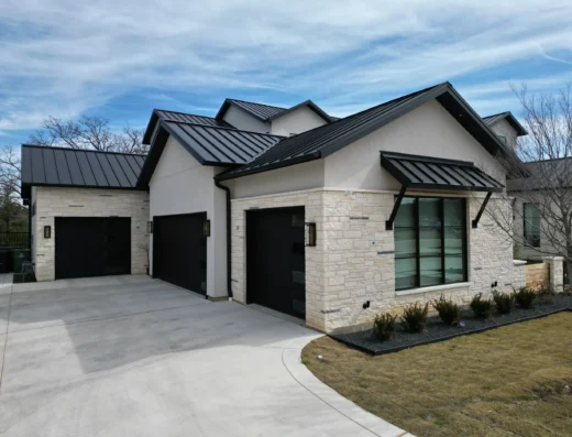 Stone and Brick Designs completed modern two-story stucco and stone home